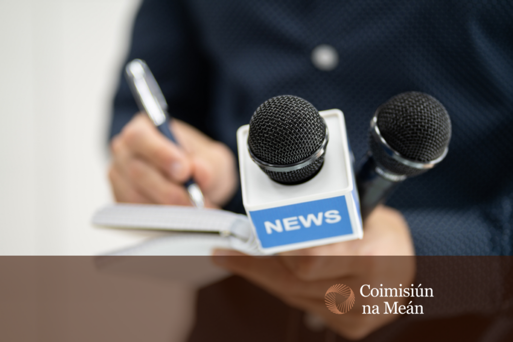 reporter holding notebook and microphone